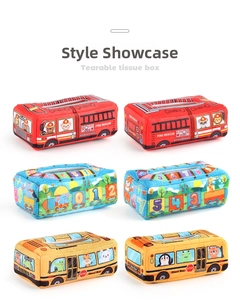 Detail view of plush cartoon tissue box toys featuring fire truck and school bus designs
