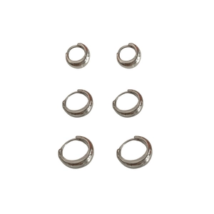 Three pairs of minimalist silver hoop earrings in small, medium, and large sizes