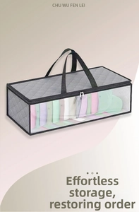 Detailed view of grey quilted hat storage bag with clear window and dual zippers