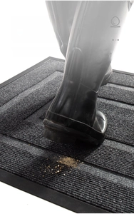 Close-up of durable dark grey entrance mat with ribbed surface for effective mud removal