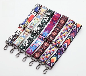 Close-up of bohemian woven bag straps with gunmetal hooks and diverse patterns