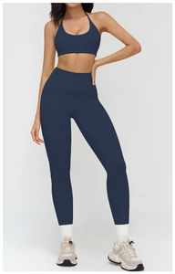 Navy blue yoga set with halter sports bra and high waisted leggings for active workouts