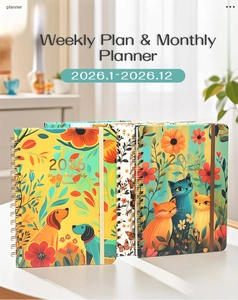 Detail of 2026 planner featuring floral and animal covers with golden coil binding