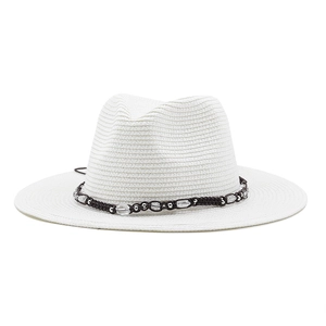 Close-up of white straw fedora featuring a bohemian beaded brown woven band detail