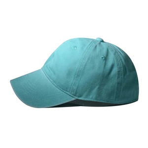 Side view of plain teal cotton baseball cap with curved brim and breathable eyelets