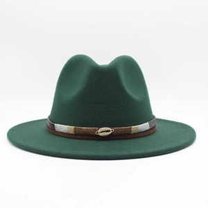 Close-up of dark green wool fedora featuring bohemian braided band and golden shell detail