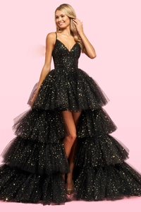 Detail of black high-low dress showing gold sequin stars and layered tulle fabric
