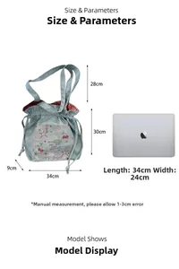 Detailed size view of a denim bow tote with embroidery and red checkered lining detail