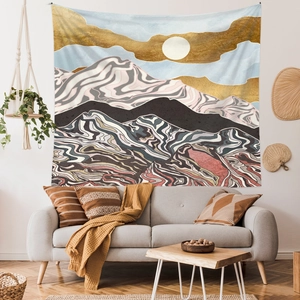 Detail of abstract bohemian mountain tapestry with gold and black flowing art patterns