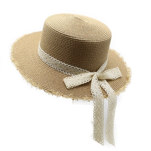 Flat top raffia straw sun hat with white lace ribbon bow and frayed edge trim