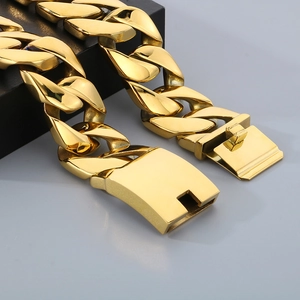 Macro shot of 24mm gold plated cuban link chain with a high-polish secure metal clasp
