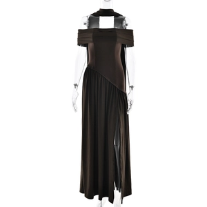Detailed close-up of dark brown slim-fit dress with high slit and elegant drapery