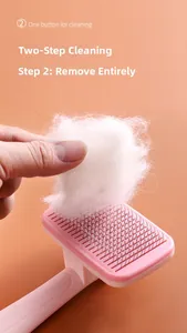 Detail showing self-cleaning pet slicker brush removing a full sheet of cat hair easily