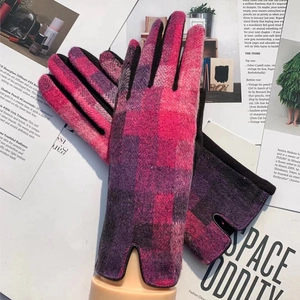 Women's pink plaid wool gloves with touch screen fingertips shown on a fashion magazine