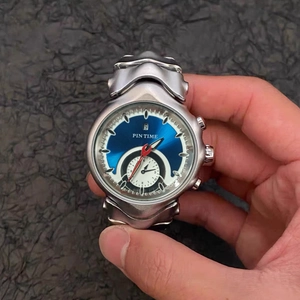 Macro shot of Pintime vintage men's quartz watch with blue dial and calendar feature