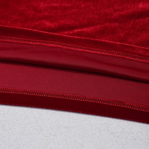 Detail of red velvet fabric showing high-quality stitching and inner lining texture