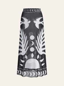 Detail of black mesh midi skirt featuring artistic white bird and moon phase prints