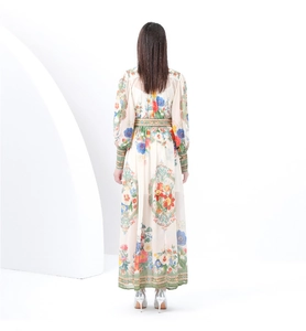 Detail of vintage floral maxi dress with elastic cuffs and woven green waist trim