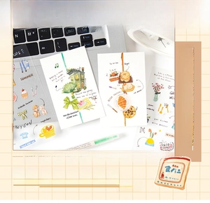 Creative collage material set with floral and food PET stickers on desktop