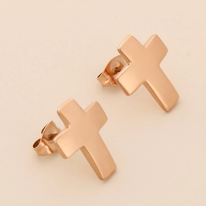 Detail of 18K rose gold stainless steel cross stud earrings with mirror polished finish