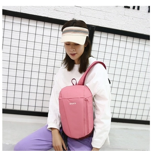 Pink nylon sports chest bag with white SPORTS text and functional zipper pocket