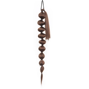 Detail of a 75cm long dark brown bubble ponytail extension made of synthetic hair fiber