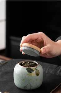 Detail of bamboo lid with non-woven seal on a ceramic tea canister for moisture protection