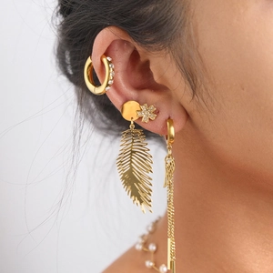 Golden boho leaf earrings set with fringe tassels and sparkling crystal accents