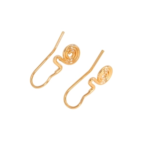 Macro detail of minimalist gold spiral clip earrings with polished metallic finish
