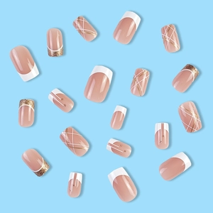 French tip press-on nails with gold glitter and geometric lines on nude base