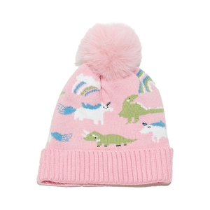 Close-up of pink knitted winter hat featuring cartoon dinosaur and unicorn prints with pompom