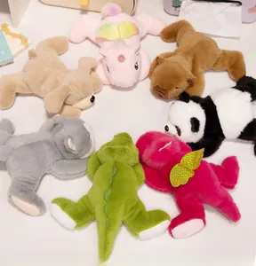 Collection of plush animal toys featuring panda, unicorn, and crocodile in soft fabric