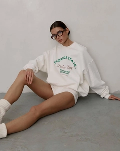 Detail of green Florida State varsity print on white crewneck sweatshirt fabric