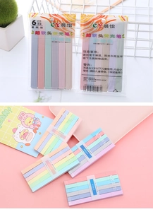 Detail view of colorful dual-tip highlighter pens packaging and safety instructions