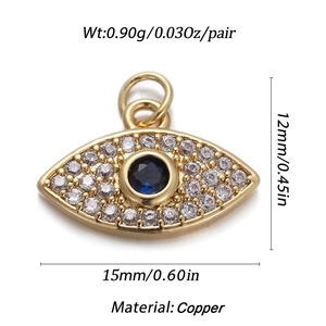 Macro shot of gold evil eye pendant with blue gem and clear zircon detailing with dimensions