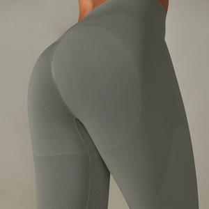 Seamless high-waisted yoga leggings in olive green with a push-up peach booty contour