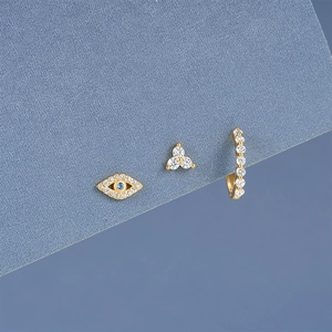 Detailed view of gold S925 silver stud earrings set featuring evil eye and crystal charms