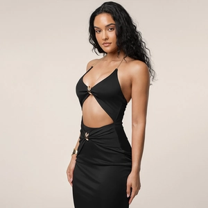 Detail of black halter dress featuring sexy waist cut-outs and golden metal rings