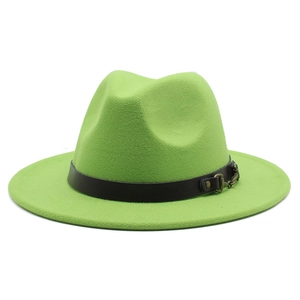 Close-up of green fedora hat featuring a black leather band and gold metal buckle