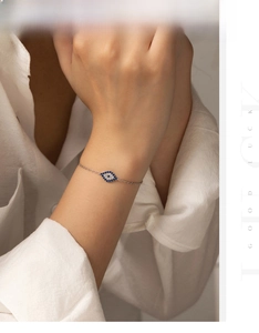 Close-up of S925 sterling silver evil eye bracelet with blue and white zircon stones