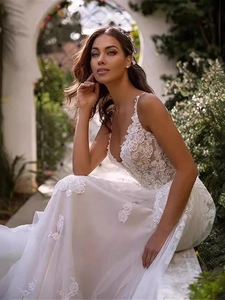 Elegant deep V-neck white lace wedding dress with floral embroidery and mesh train