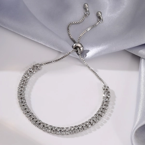 Detail of double-row crystal tennis bracelet with adjustable sliding toggle clasp