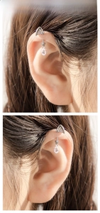 Detail of silver cat ear cartilage stud with a teardrop zircon pendant on ear