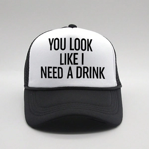 Classic black and white trucker hat with YOU LOOK LIKE I NEED A DRINK text print