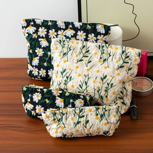 Daisy embroidered canvas cosmetic bags in black and cream white, four-piece set for women