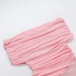 Close-up detail of pink ruched fabric design on elegant off-shoulder cocktail dress