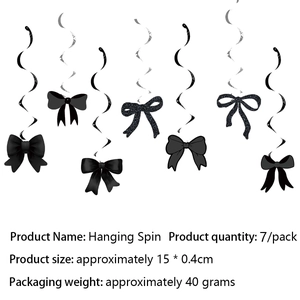 Detail view of metallic black spiral streamers and soft black bow party decorations
