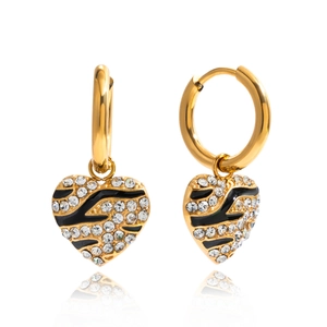 Golden heart earrings with zebra pattern enamel and pavé crystals on white background
