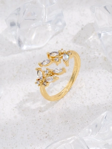 Detailed shot of 18K gold adjustable leaf ring featuring micro-pave cubic zirconia crystals