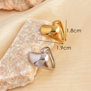 Polished 18K gold and silver waterdrop rings on stone background with size dimensions